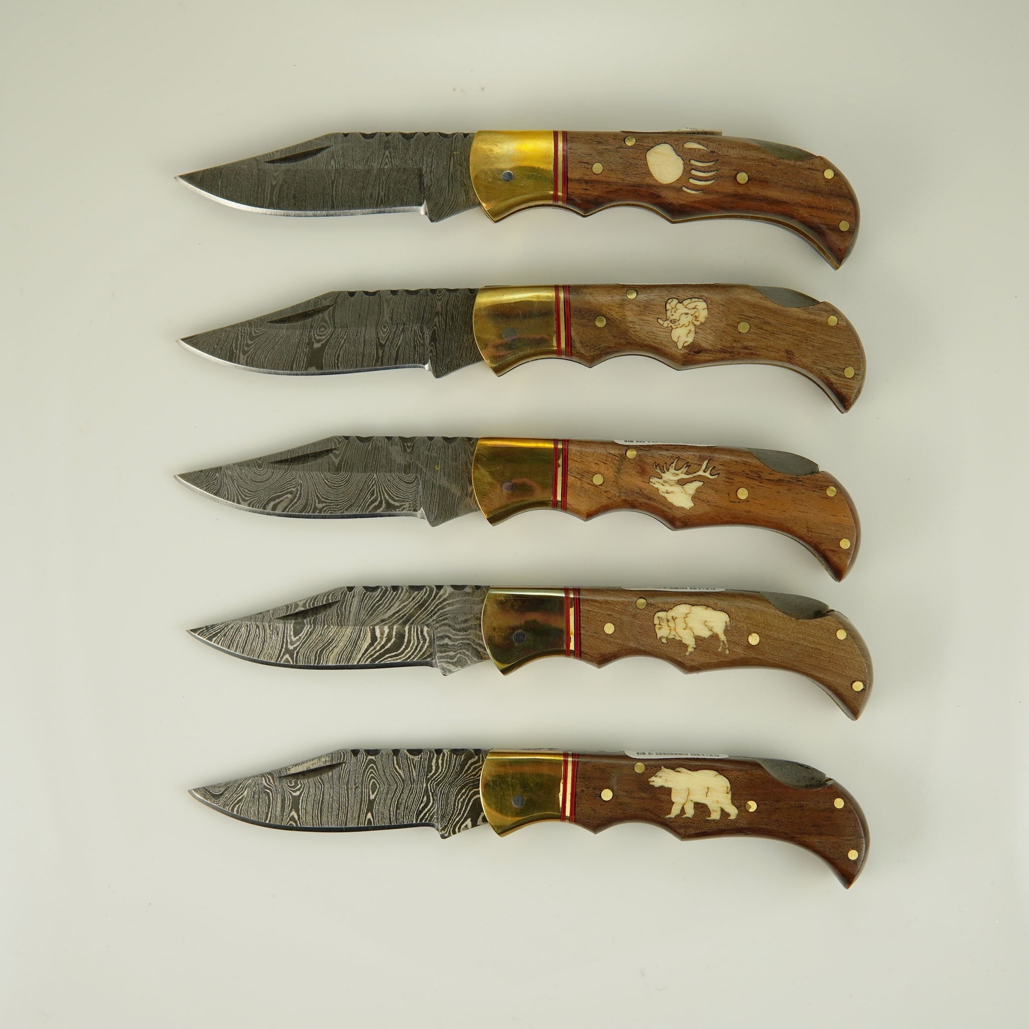 Damascus 4" Knife with Walnut Grip and Brass Bolster